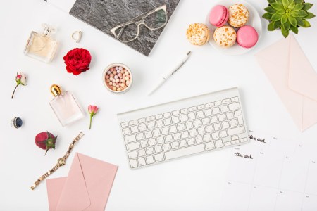 top-view-of-white-office-female-workspace-with-pc-PCJVTC5.jpg